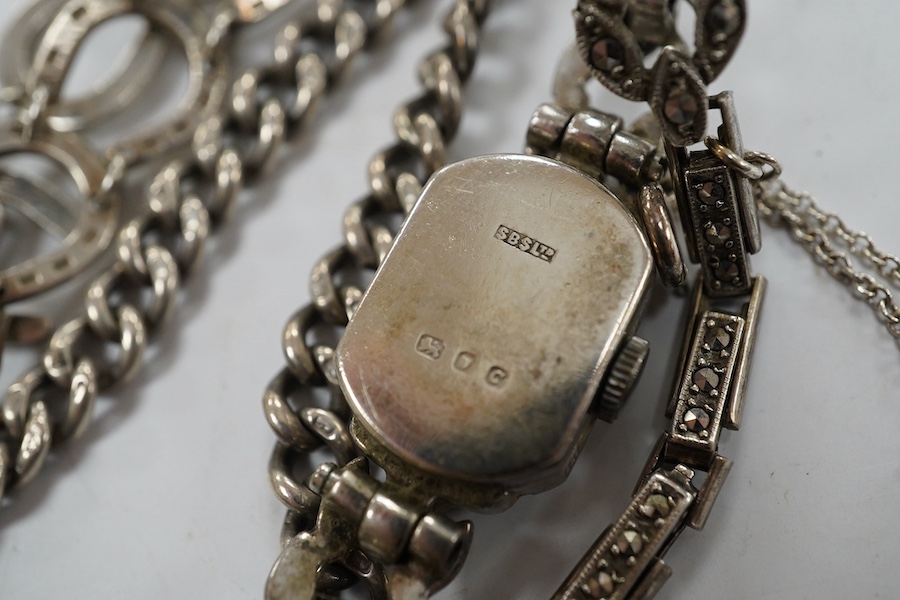 Two silver bracelets, a silver watch chain, a silver and marcasite bracelet and a similar watch. Condition - fair